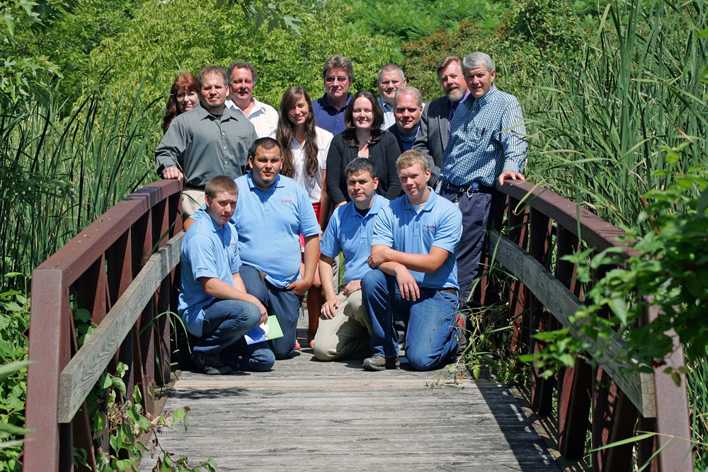 Representatives from the three organizations involved in developing the apprenticeship program join the first four apprentices on the bridge that connects Boschs New Richmond Wis facility grounds and the Wisconsin Indianhead Technical College campusBack row LR Nancy Cerritos WITC Kevin Lipsky WITC Pres Lawhon Bosch Olaf Wick WITC Randy Deli WITCMiddle row LR Travis Ludvigson State of Wisconsin Bureau of Apprenticeship Standards Alexandra Nungesser Bosch Ashley Bauman Bosch Chris Jehle Bosch Mark Hanson