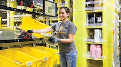 An Amazon employee picks items in the e-retail giant&apos;s eighth-generation fulfillment center. Omni-channel distribution offers a way for traditional retailers to keep pace through &apos;store as warehouse&apos; strategies.