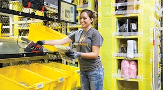 An Amazon employee picks items in the e-retail giant&apos;s eighth-generation fulfillment center. Omni-channel distribution offers a way for traditional retailers to keep pace through &apos;store as warehouse&apos; strategies.
