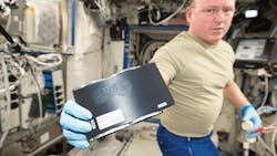 US astronaut Barry Wilmore holds a 3D coupon that was used with a 3D printer aboard the International Space Station to print a socket wrench NASA photo US astronaut Barry Wilmore holds a 3D coupon that was used with a 3D printer aboard the International Space Station to print a socket wrench NASA photo