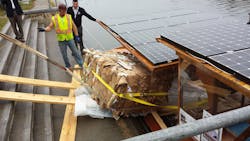 The bales of recycled cardboard emerge from the cargo hold of Solar Sal Each bale weighed about 1200 lbs The bales of recycled cardboard emerge from the cargo hold of Solar Sal Each bale weighed about 1200 lbs