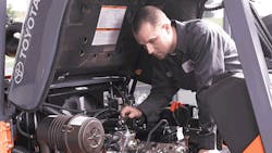 A Prolift associate at Toyota Material Handling USA Inc services a lift truck A Prolift associate at Toyota Material Handling USA Inc services a lift truck