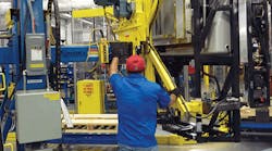 Trailer units at Carrier Transicold are rotated to their upright position to complete the manufacturing process. Electronic controls and safety devices are in place to assist the operator for an efficient and safe transfer of the unit. Trailer units at Carrier Transicold are rotated to their upright position to complete the manufacturing process. Electronic controls and safety devices are in place to assist the operator for an efficient and safe transfer of the unit.