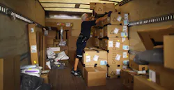 man loading Fedex truck man loading Fedex truck