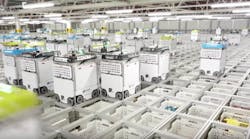 Robots collect and pack orders at an Ocado fulfillment center in the U.K.