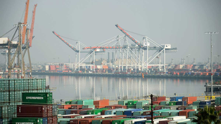 Virus Squeezes Ports Sounding Warning Bell for US Economy