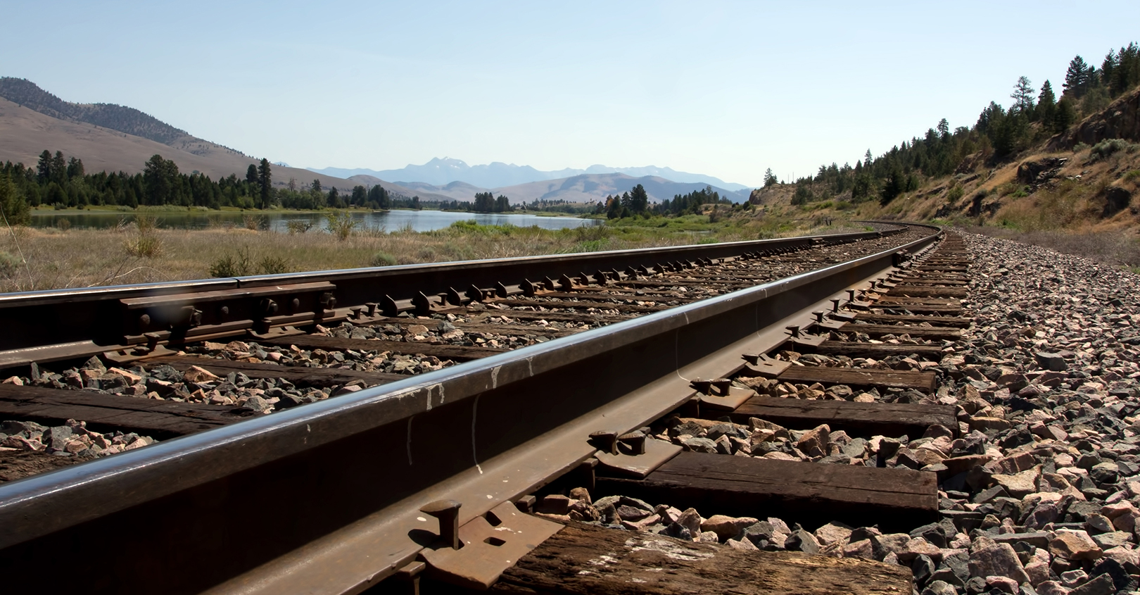 Railroad Tracks Near River 601b76a726dfc